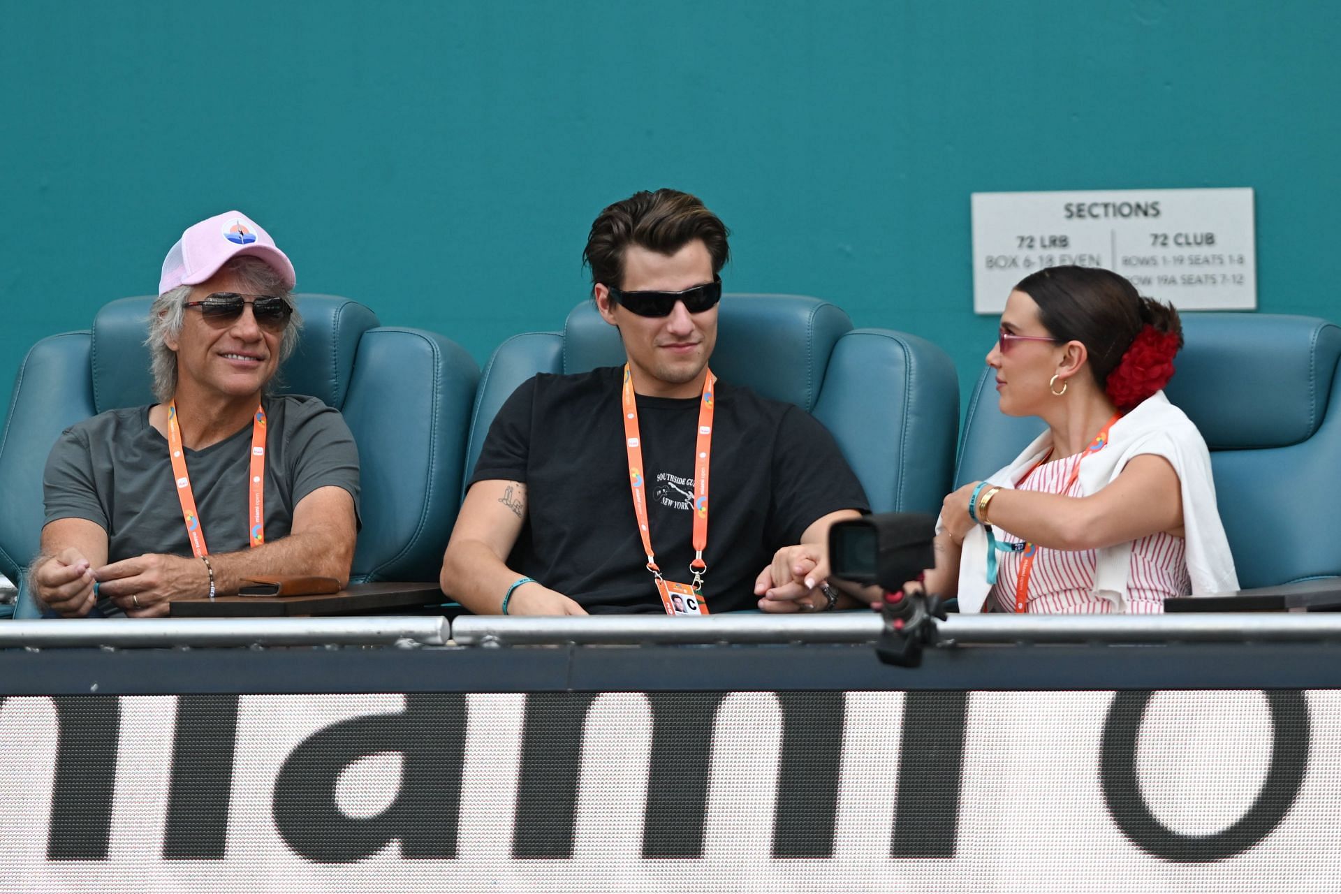 Bobby Brown with her husband and father-in-law at the Miami Open (Image via Getty)